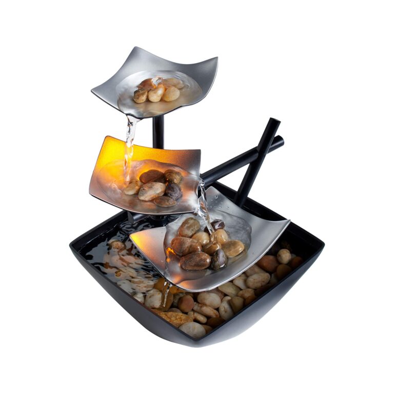 Indoor water fountain with tiered silver bowls and river rocks