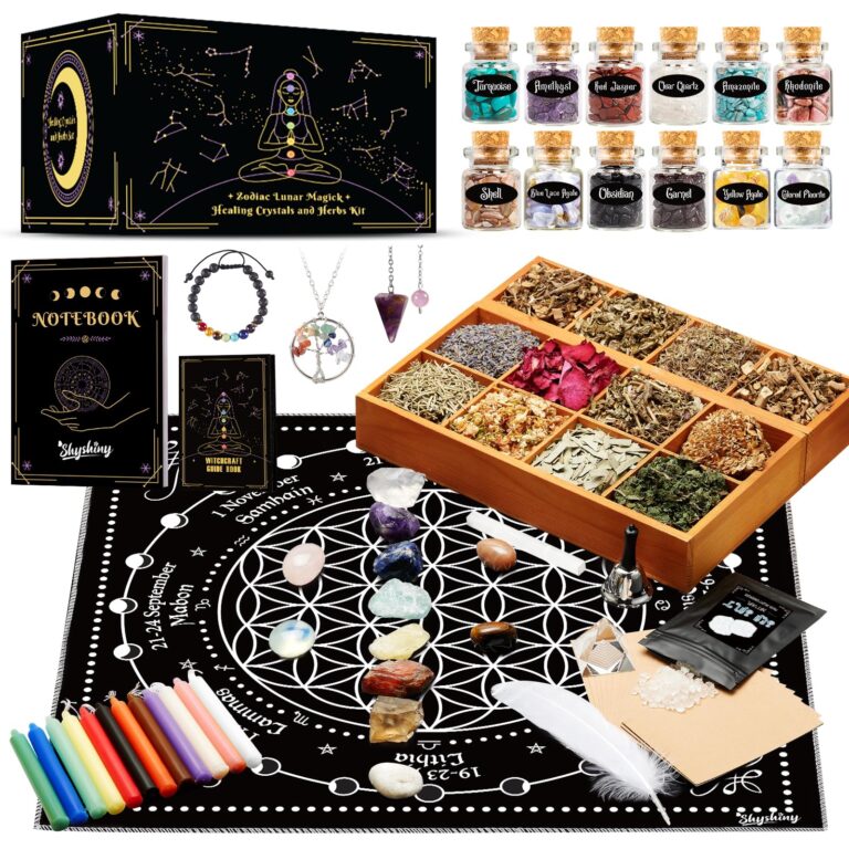 A collection of crystals, herbs, and ritual items on a black mat